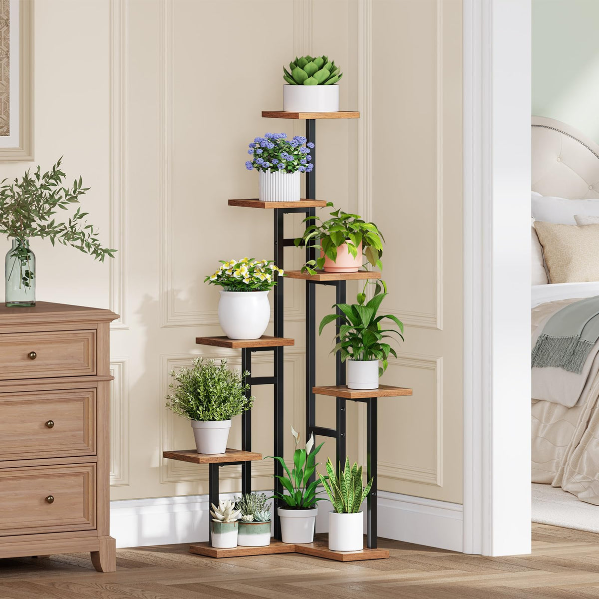 Decorative plant stand with various potted plants in a room setting.