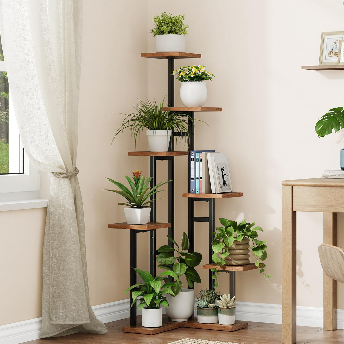 Decorative plant stand with various potted plants against a neutral wall.