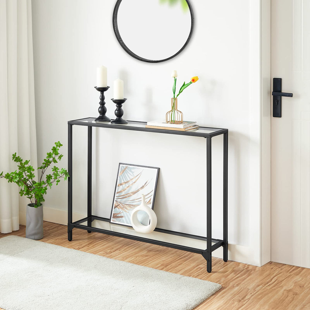 Black console table with decorative items in a room setting
